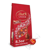 Lindt LINDOR Milk Chocolate Candy Truffles. Chocolates with Smooth. Melting Truffle Center. 8.5 oz. Bag