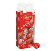 Lindt LINDOR Milk Chocolate Candy Truffles Traditions Gift Box. Milk Chocolate Candy with Smooth. Melting Truffle Center. 6.8 oz.