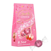 Lindt LINDOR Strawberries and Cream White Chocolate Candy Truffles. Valentine's Day White Chocolate with Strawberries and Cream White Truffle Filling. 8.5 oz. Bag