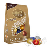 Lindt LINDOR Assorted Chocolate Candy Truffles. Chocolate with Smooth. Melting Truffle Center. 12.7 oz. Bag